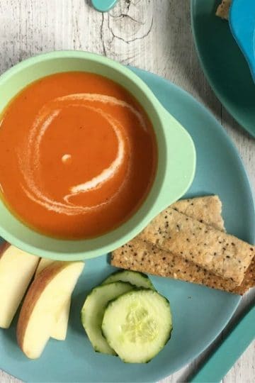 Creamy Tomato Soup is a kid friendly and vegan soup that is great for school lunches.