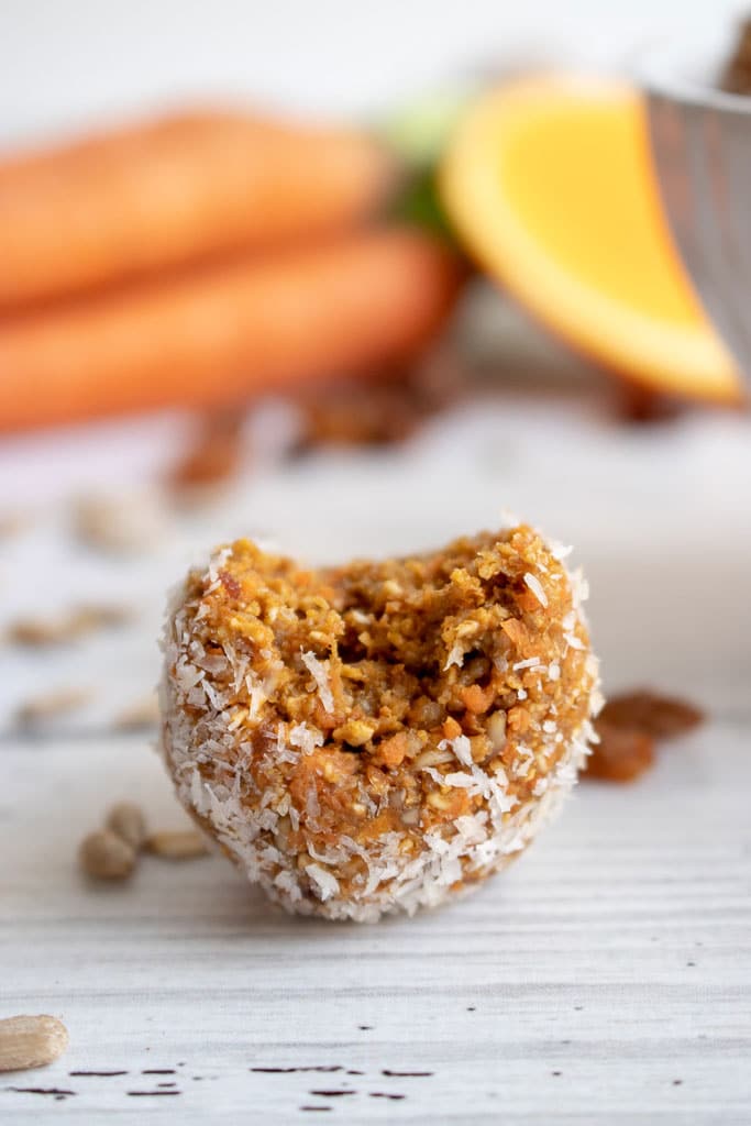 picture of carrot oat bliss ball with bite removed