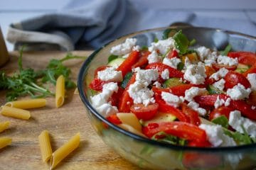 image of roasted vegetable and rocket salad with goats cheese in a bowl