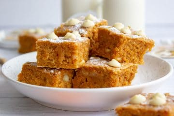 gingerbread blondies stacked on a plate