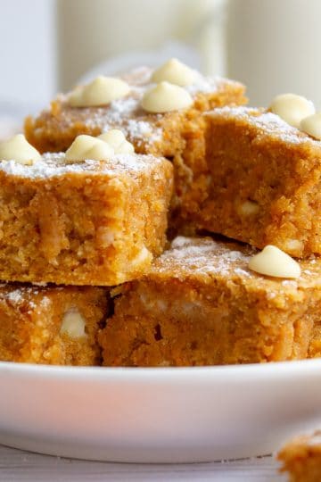 gingerbread blondies stacked on a plate