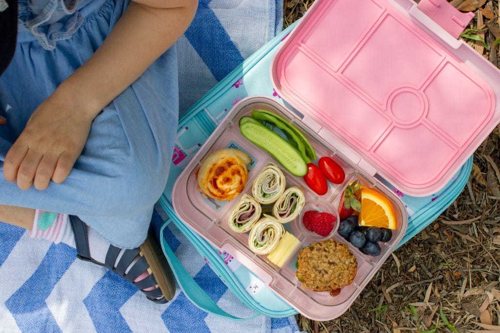 picture of child next to a bento box