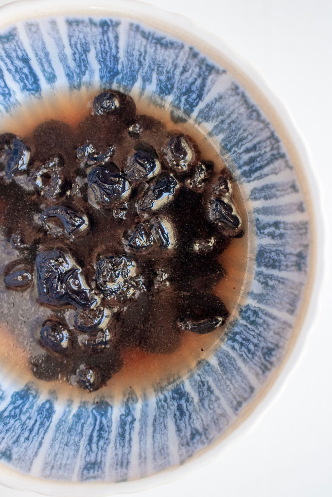 bowl of dried blueberries soaking in hot water to soften