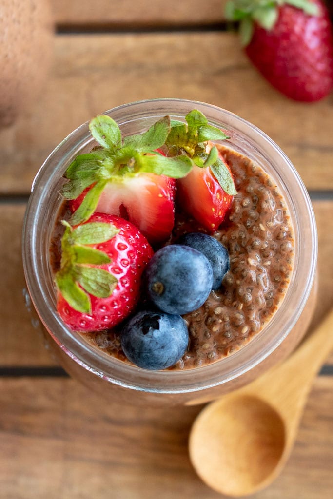 Image of Chocolate Chia Pudding with berries in a jar