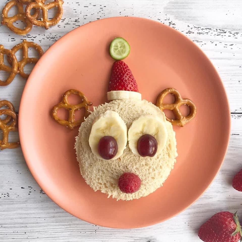 Q: Did Rudolph go to school?
A: Nope – he was elf-taught 🦌❤️🎄

Unlike Rudolph my kids go to school and today is the last day! 🙌 7 weeks of holidays awaits ❤️

If you want to make this Rudolph sandwich plate it’s so easy and fun and the perfect festive lunch.

You will need:
➕ two slices of bread cut into a circle (I used a large smoothie cup and pressed firmly to cut the bread)
➕ filling of choice (I used peanut butter) to make the sandwich
➕ pretzels for the antlers
➕ a raspberry for the nose
➕ banana and grapes (cut grapes in half for young children) for the eyes
➕ more banana, a halved strawberry and a slice of baby cucumber for the Santa hat

Have a fab day! 🦌❤️🎄
