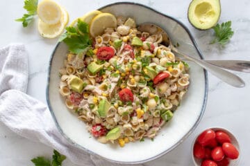 Bowl of Tuna Pasta Salad garnished with parsley.