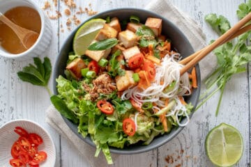 bowl of rice noodle salad with chopsticks in the bowl